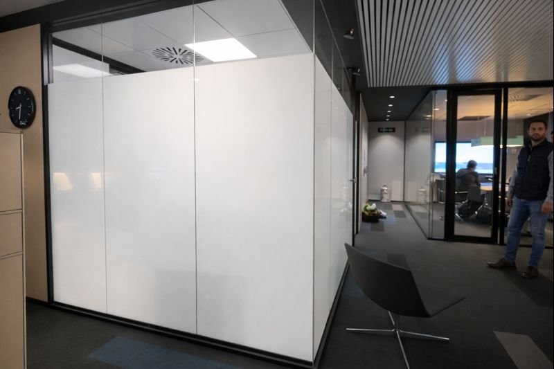 Frosted switchable privacy glass in the same Miami office interior